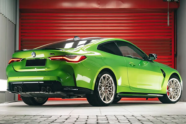 Clear paint protection film on green car